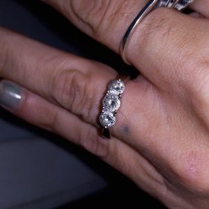 A caret and a half white gold engagement ring with three beautiful diamonds